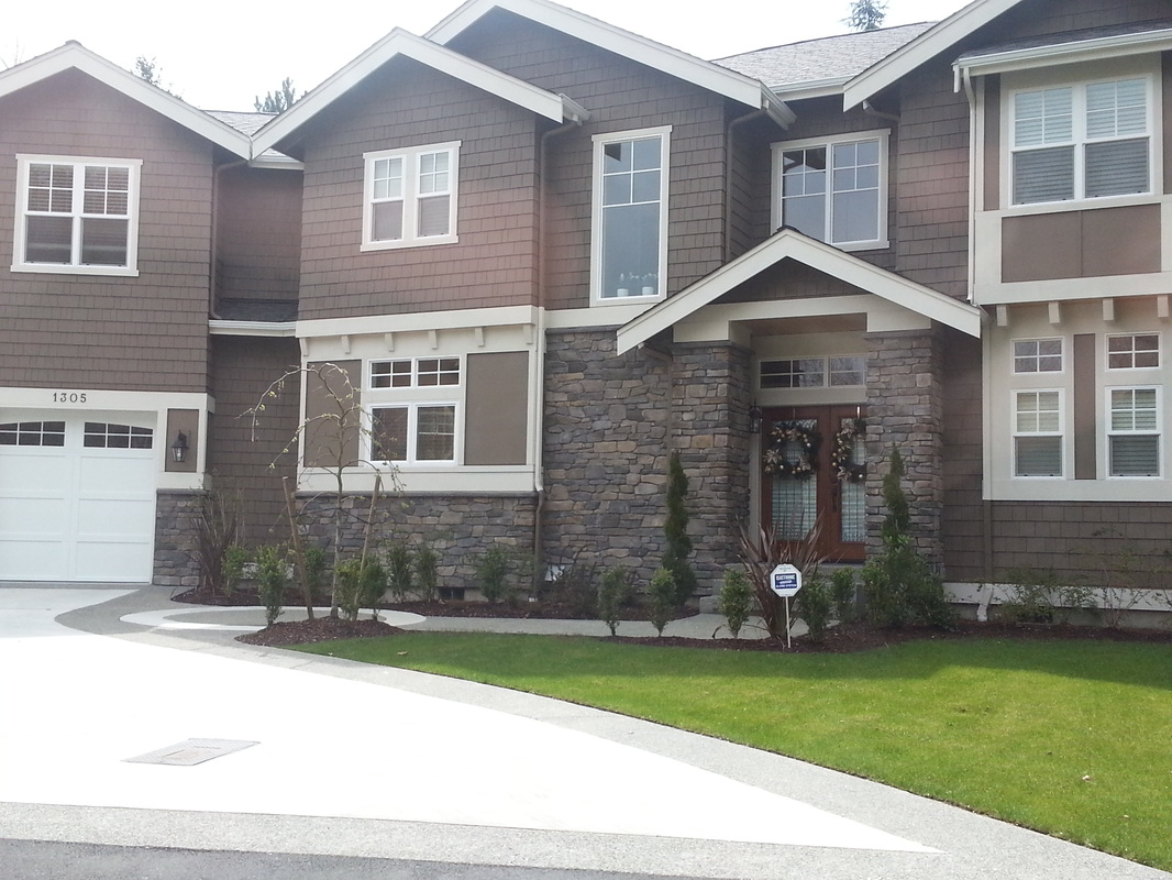 Exterior home with stone entry veneer detail